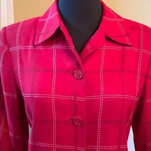 Red blazer with black and white heavy stitching